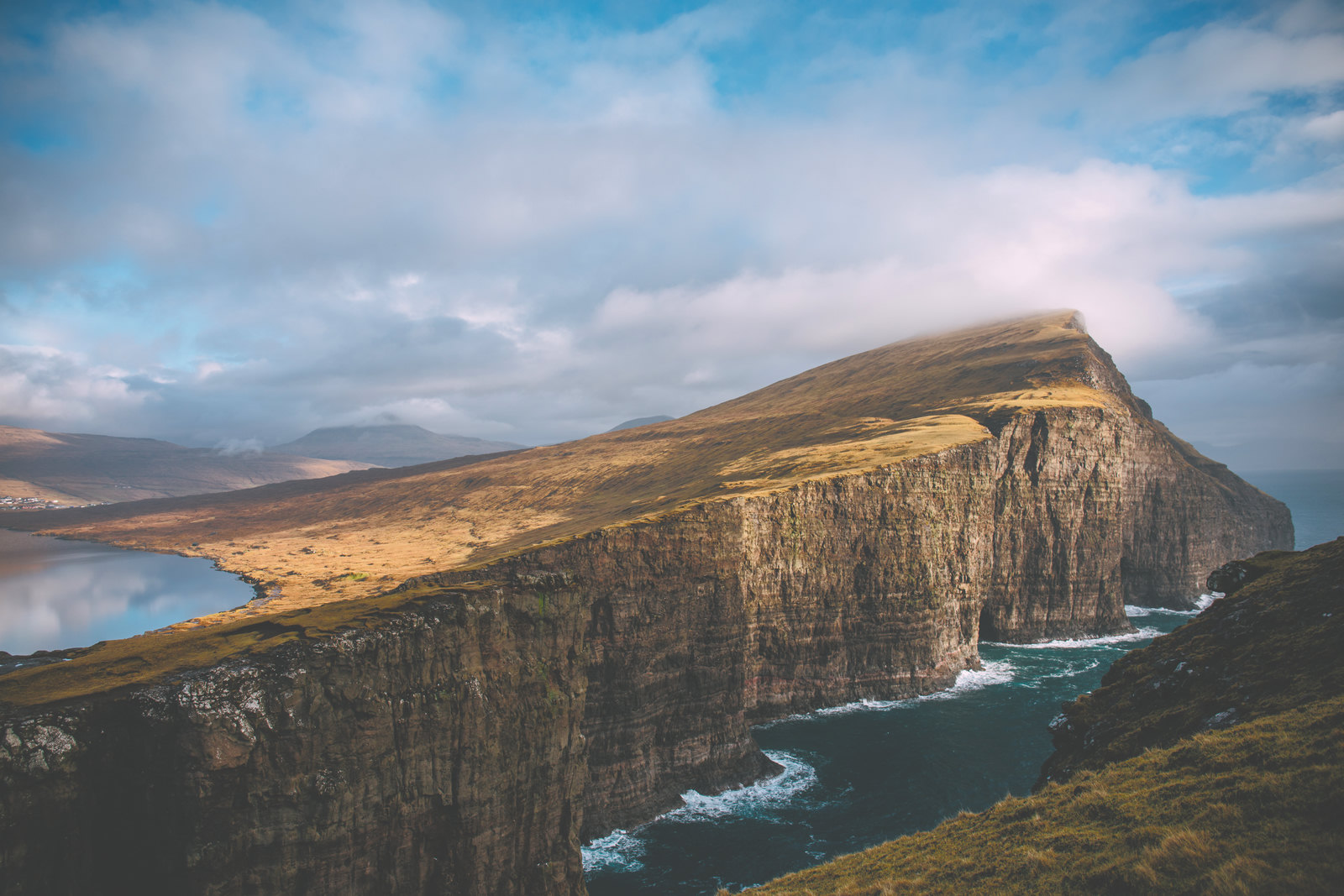A Faroe Islands sea cliff, mid-grade — exposure, contrast, highlights and shadows already adjusted